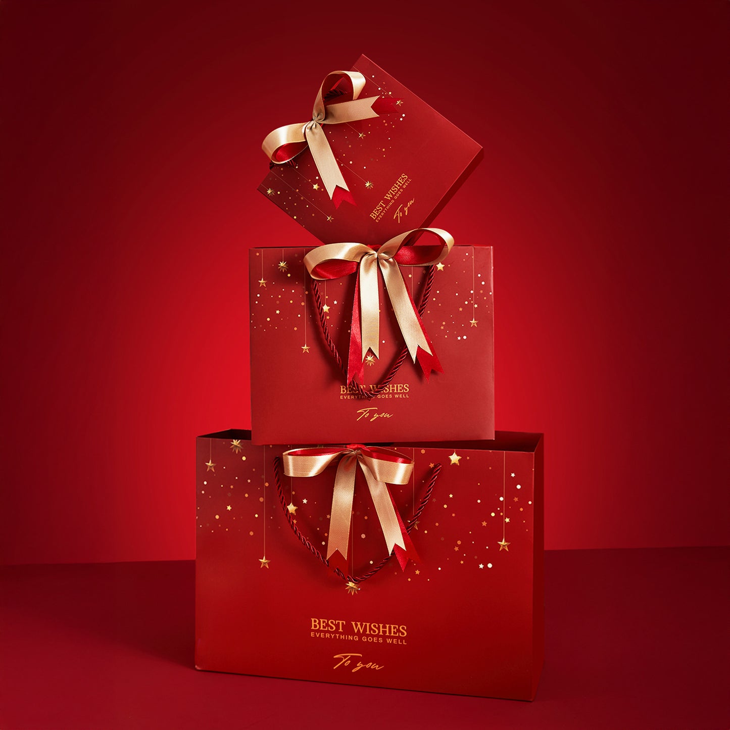 Shimmering Star Print Gift Bag with Golden Bow